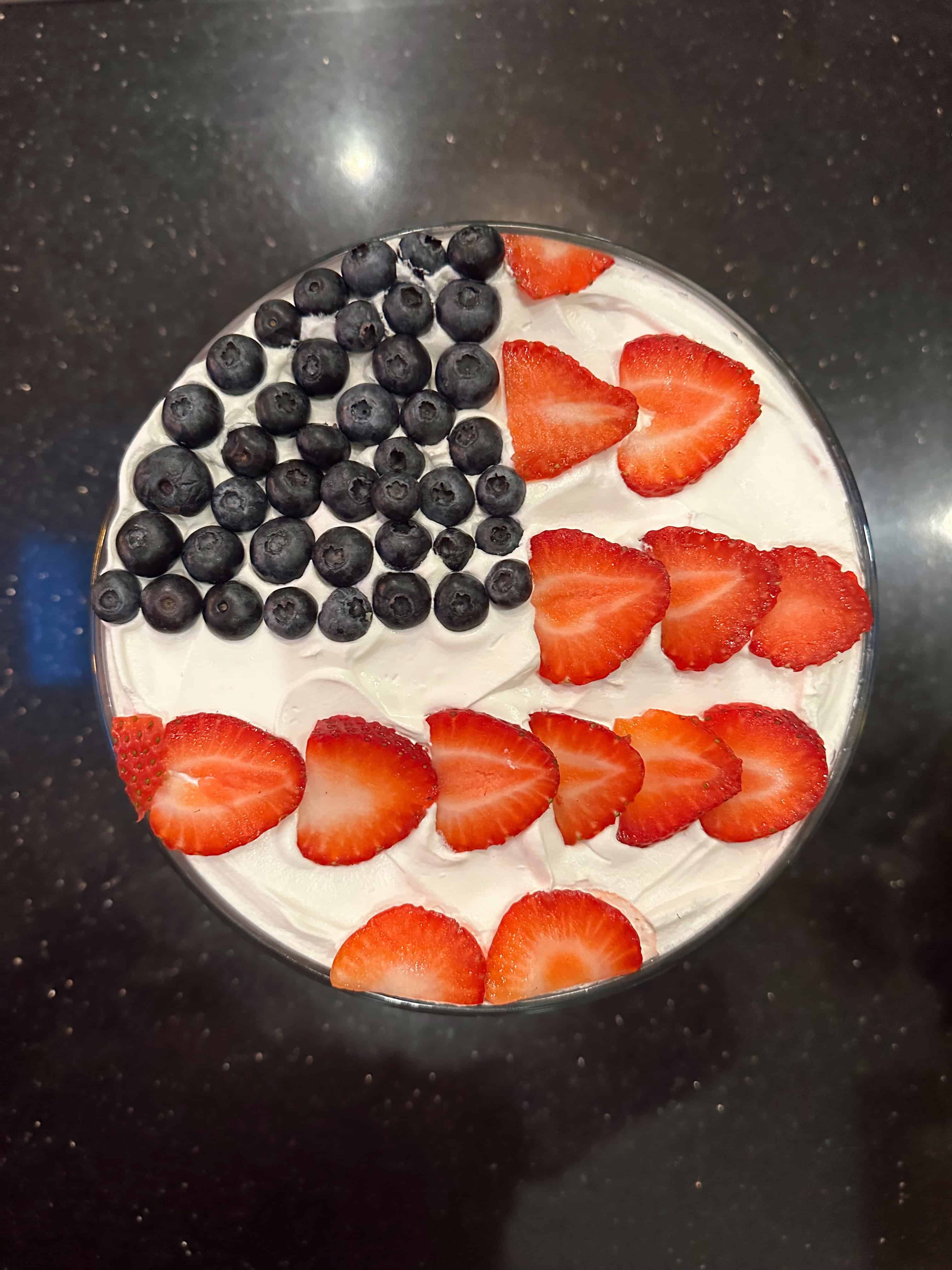 Trifle decorated with berries to create flag design