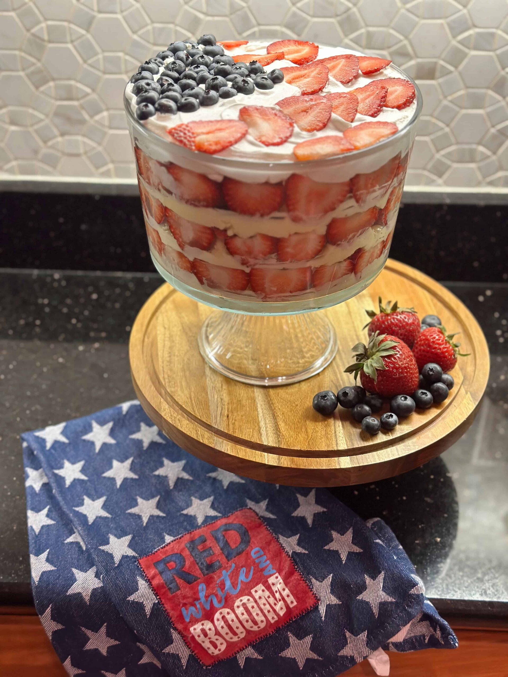 Festive strawberry trifle dessert set a top a cake display