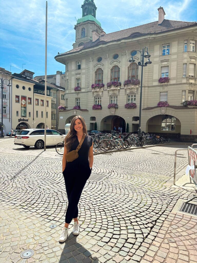 posing in front of church in Bolzano, Italy