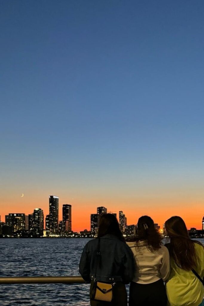girls staring at nyc skyline