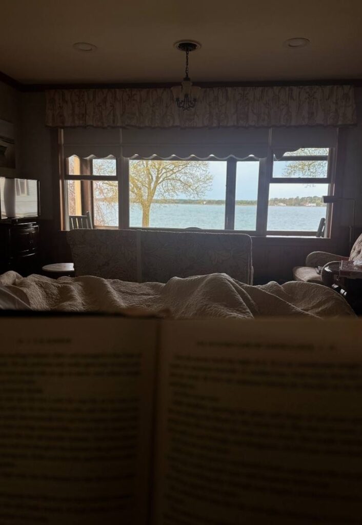 Sunrise at Sandaway Suites and Beach from our bed reading a book