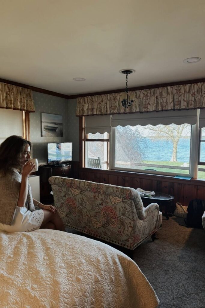 Camille sipping coffee in the deluxe 2nd floor suite at Sandaway Suites and Beach