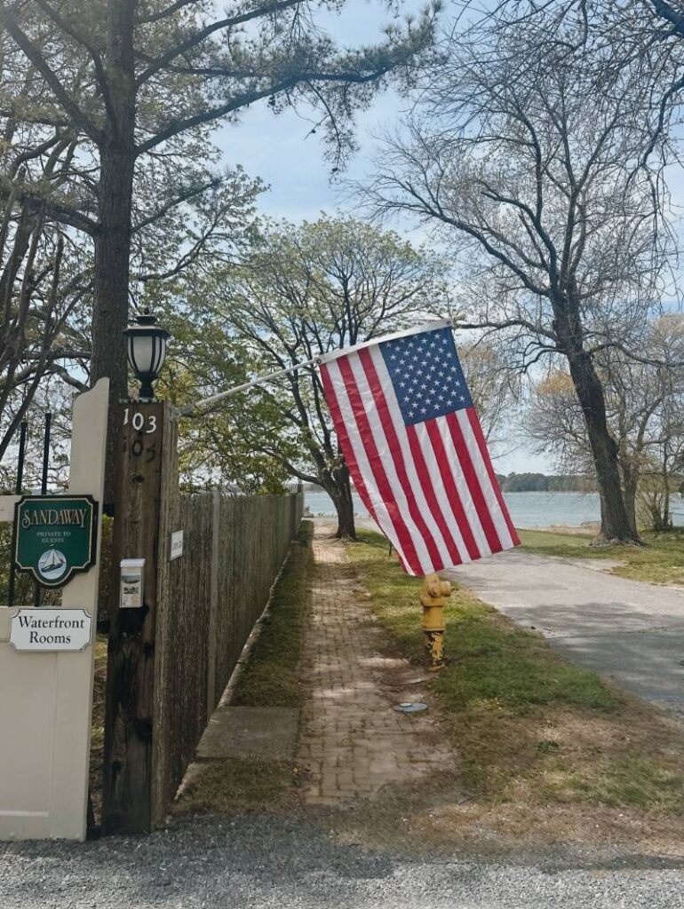 Sandaway Suites & Beach flag blowing in the wind