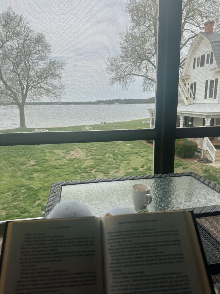 Reading a book at Sandaway Suites & Beach in Oxford, Maryland